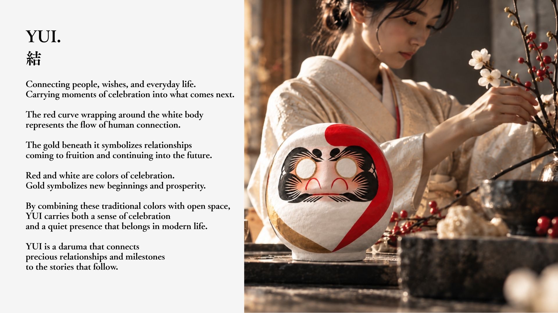 A woman in kimono arranging flowers beside a red, white and gold daruma — the world of YUI